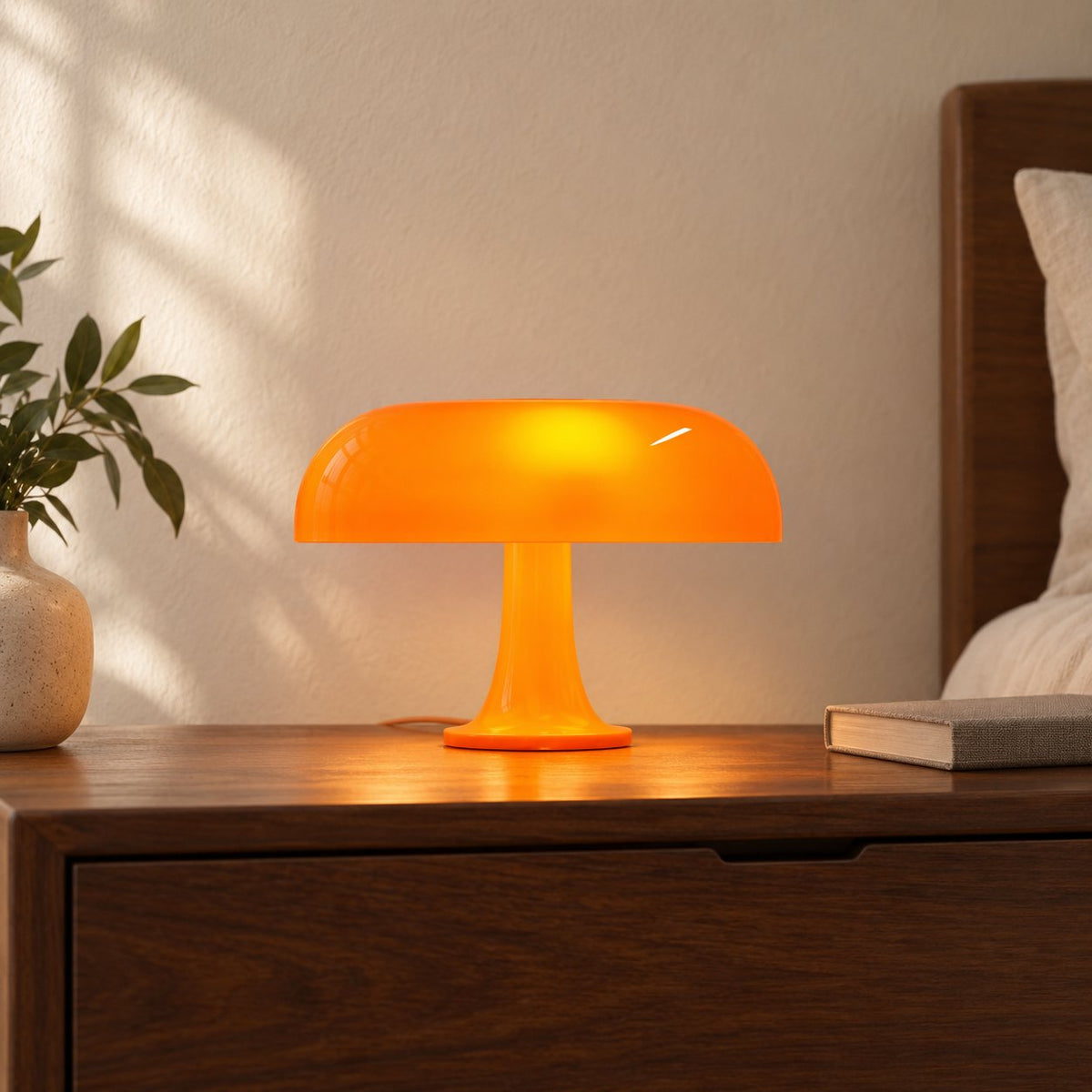 Orange Mushroom LED Table Lamp on a walnut bedside table